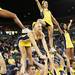 Michigan cheerleaders excite the crowd as Michigan took on Ferris State at the Crisler Arena Friday November 11, 2011. (AP Photo/AnnArbor.com, Jeff Sainlar I AnnArbor.com)